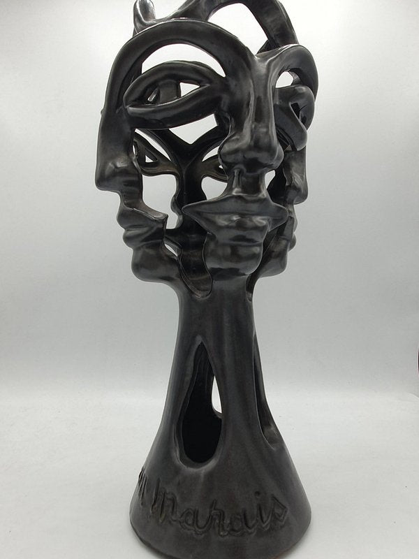 Vase ajouré aux quatre visages par Jean Marais