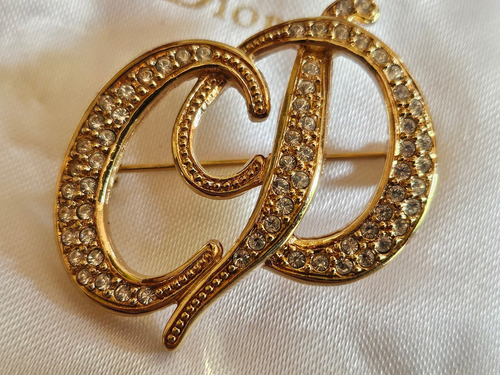Broche Christian Dior avec son coussin et sa boite