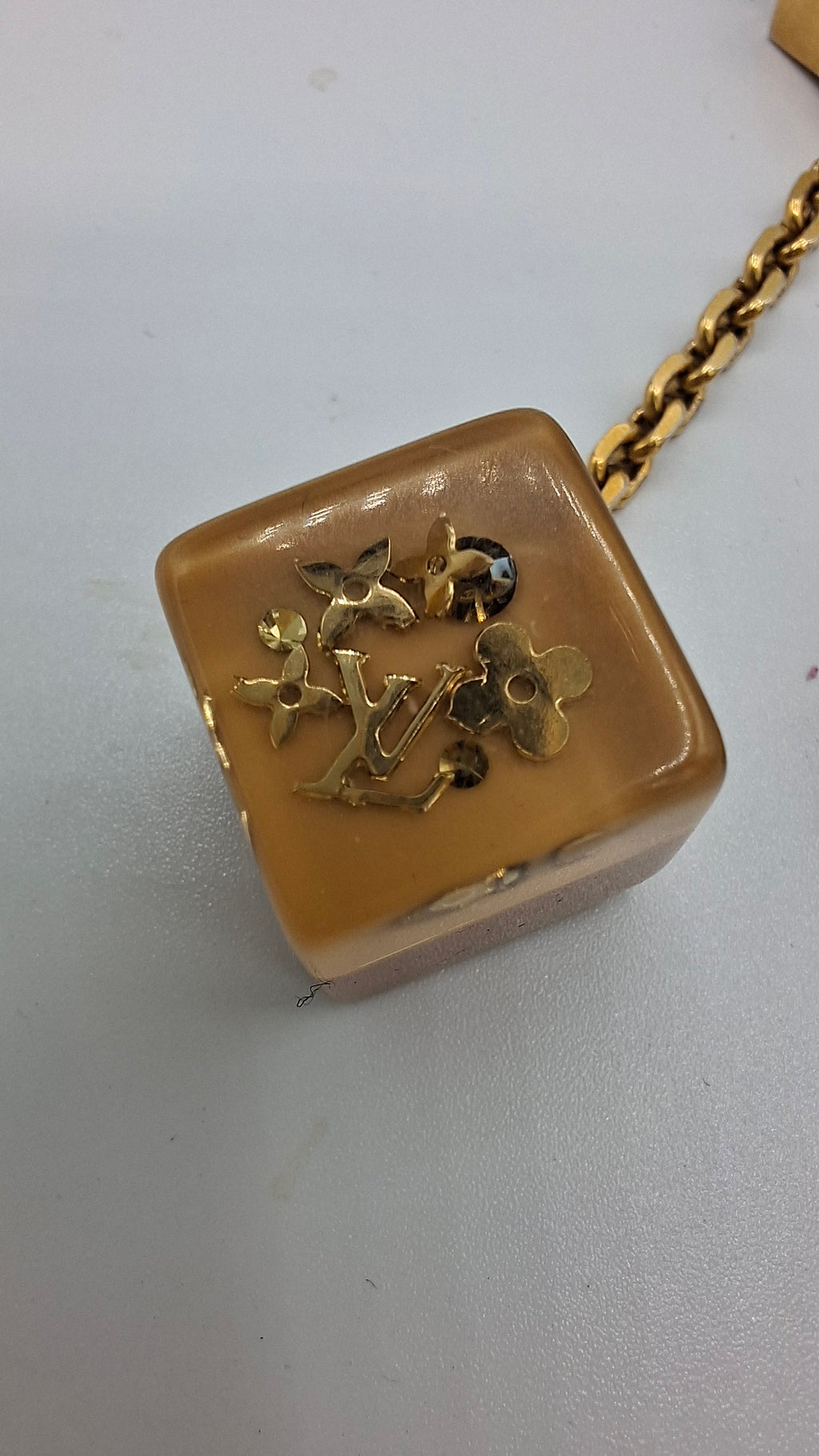 Bijou de sac Louis Vuitton deux dés