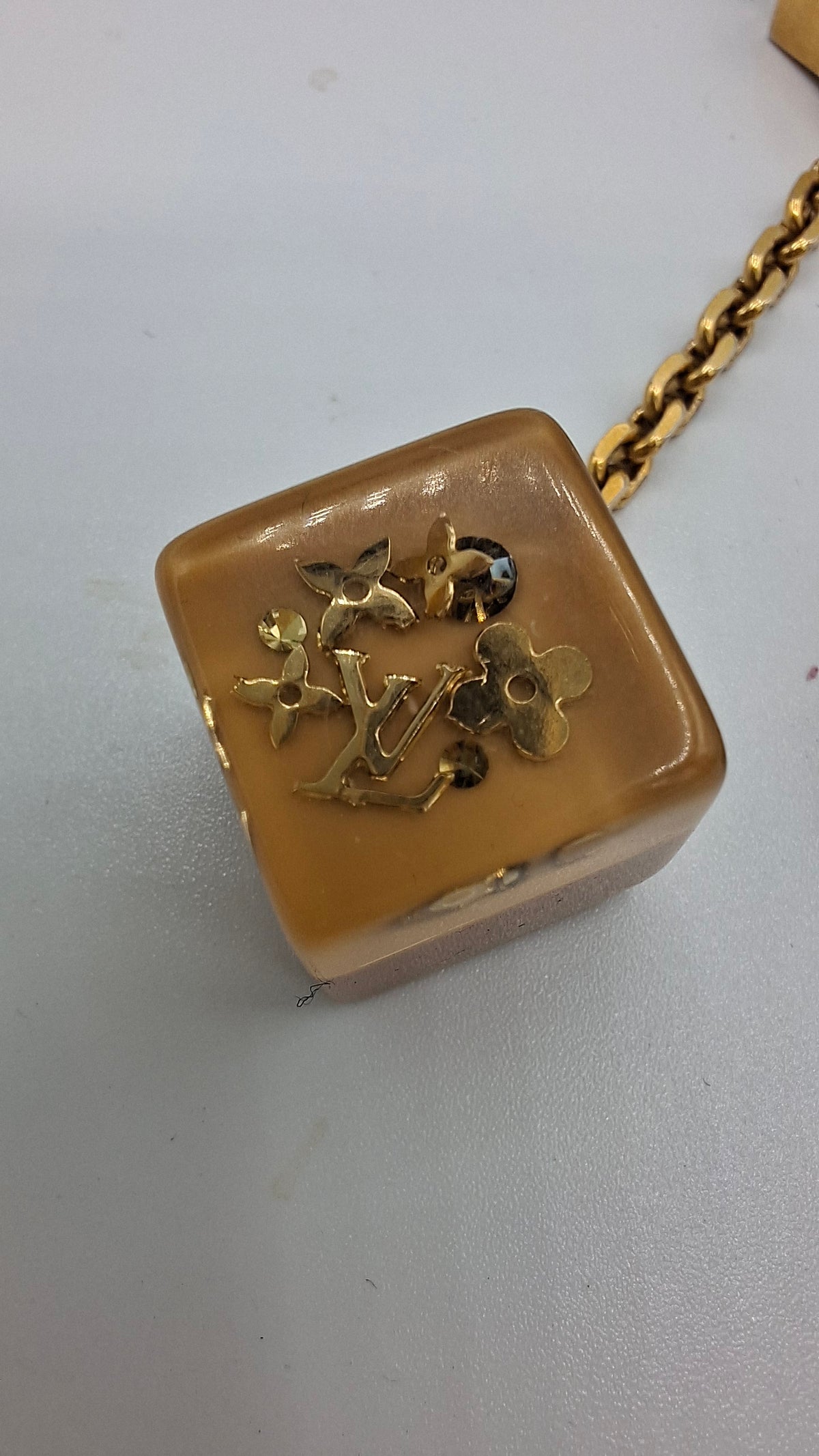 Bijou de sac Louis Vuitton deux dés