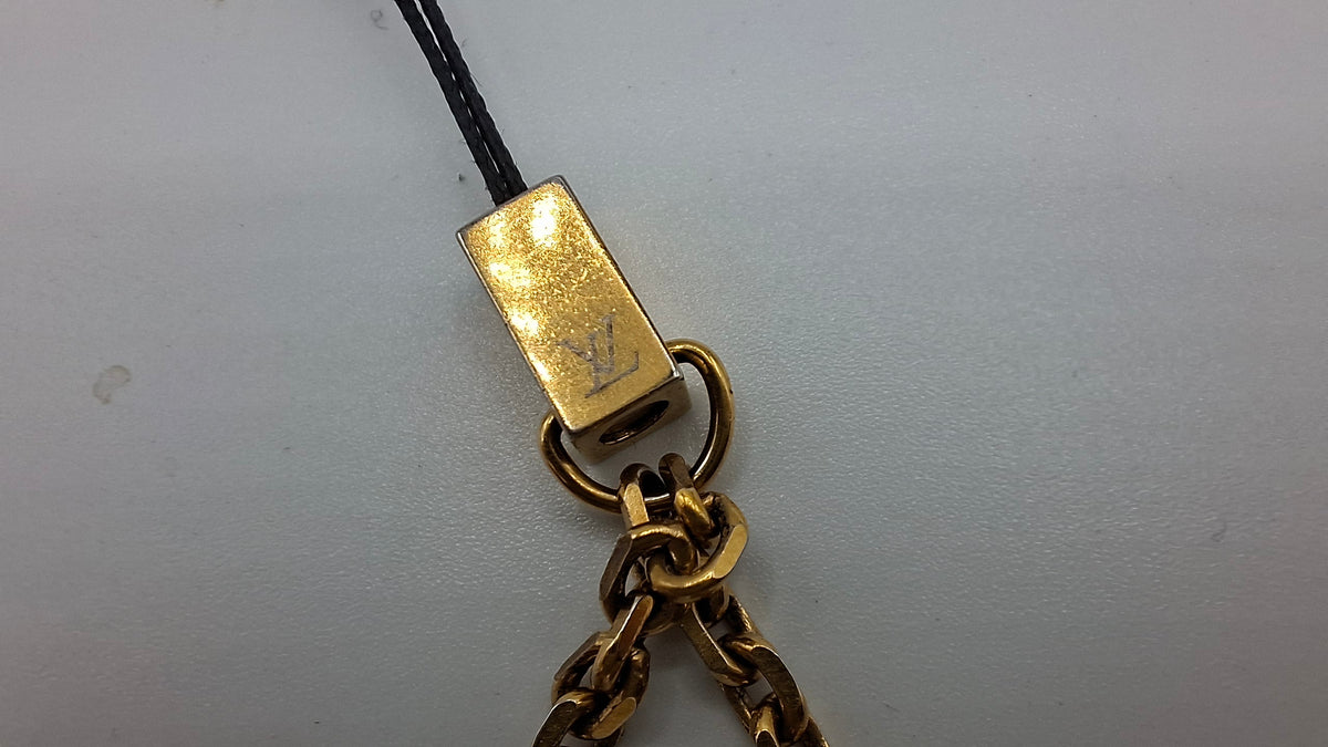 Bijou de sac Louis Vuitton deux dés