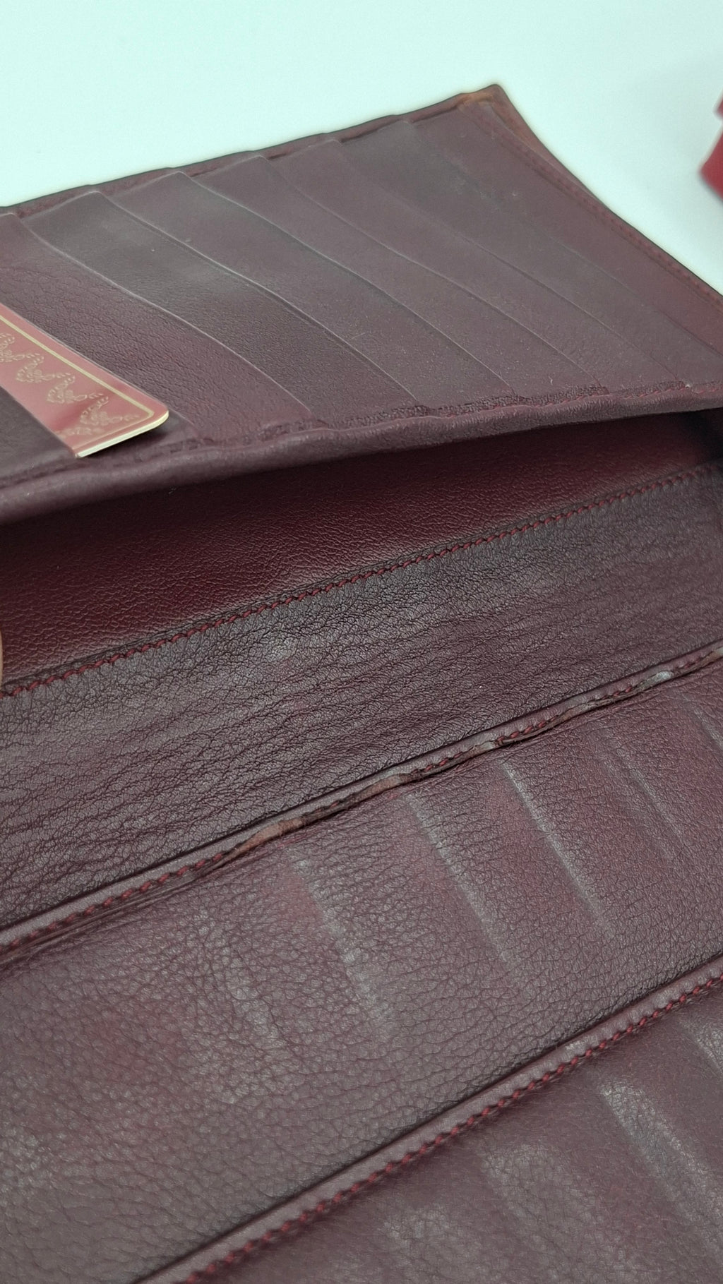 Portefeuille femme Cartier en cuir avec boite et accessoires