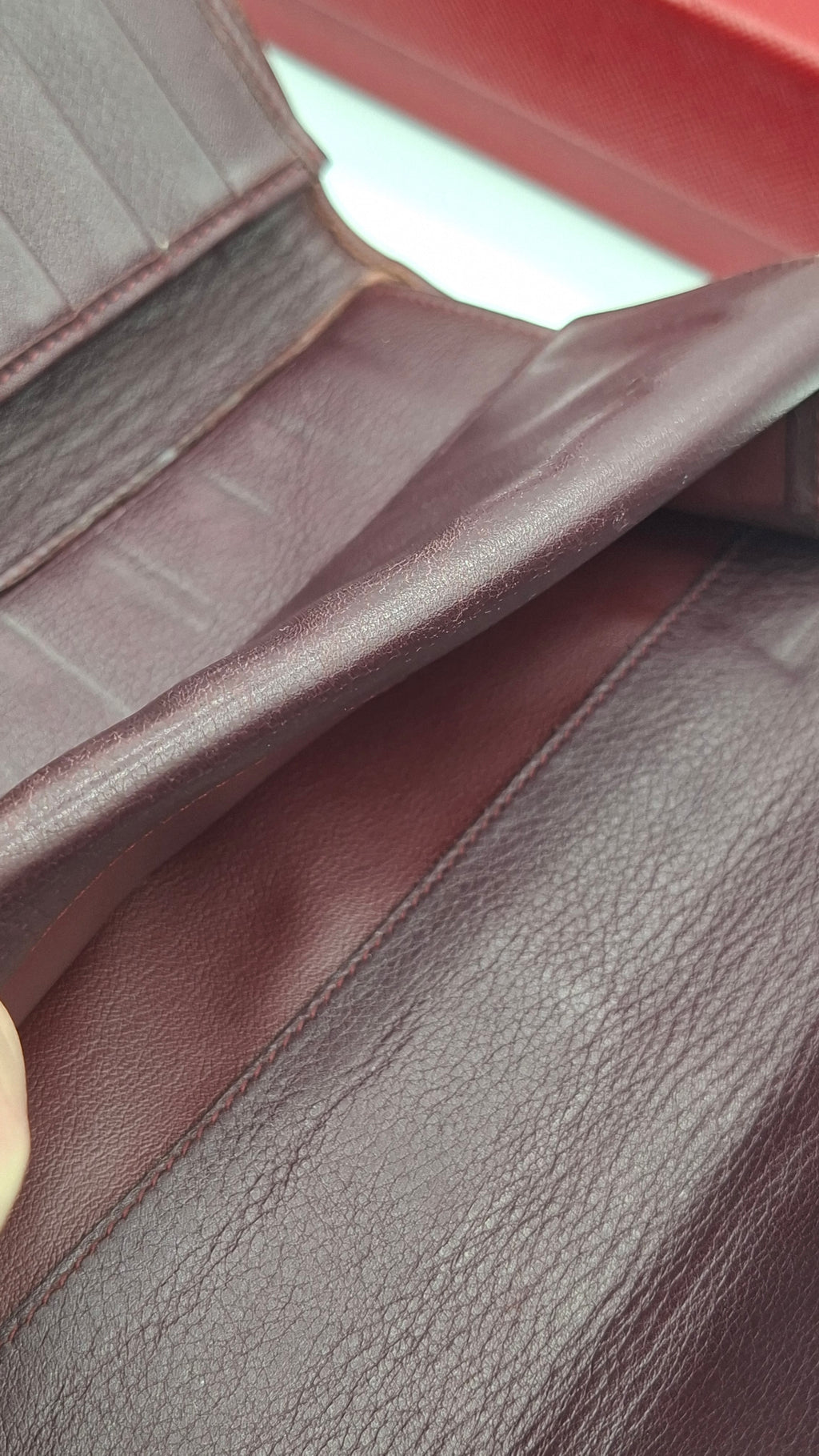 Portefeuille femme Cartier en cuir avec boite et accessoires