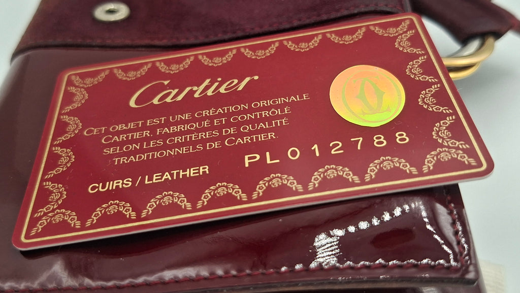 Portefeuille femme Cartier en cuir avec boite et accessoires