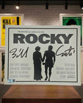 Affiche du film Rocky signée par le compositeur Bill Conti. Beckett