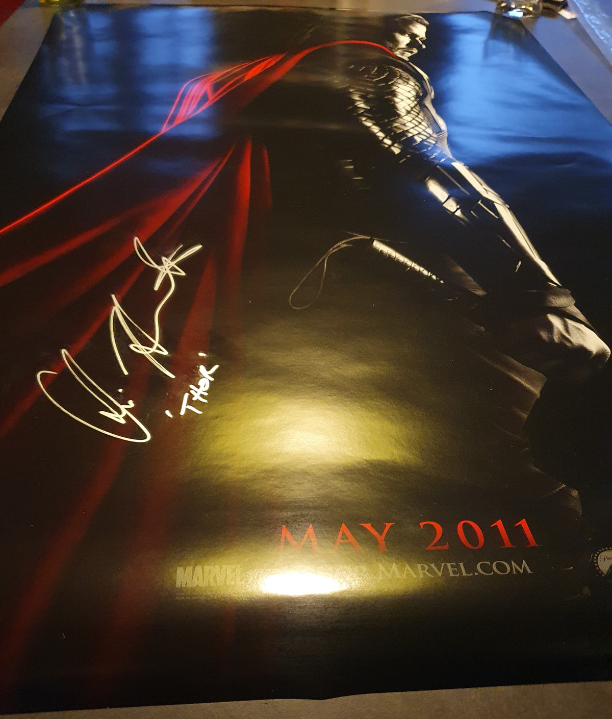 Chris Hemsworth signs Thor movie poster