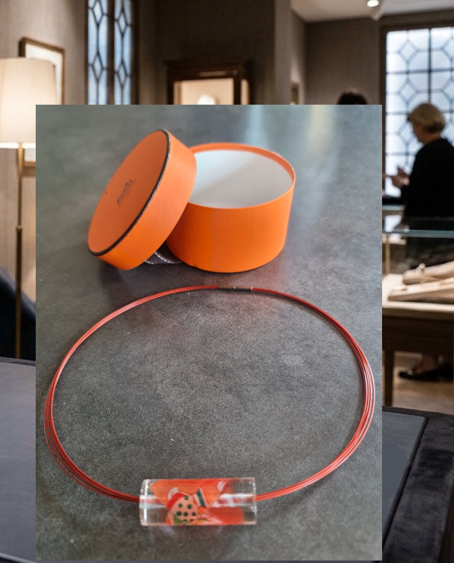 Collier et pendentif Hermès orange
