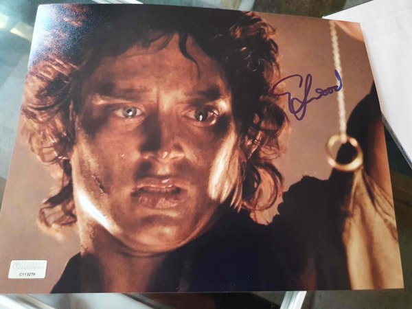 Elijah Wood signe une photo du film Le seigneur des anneaux + cadre .
