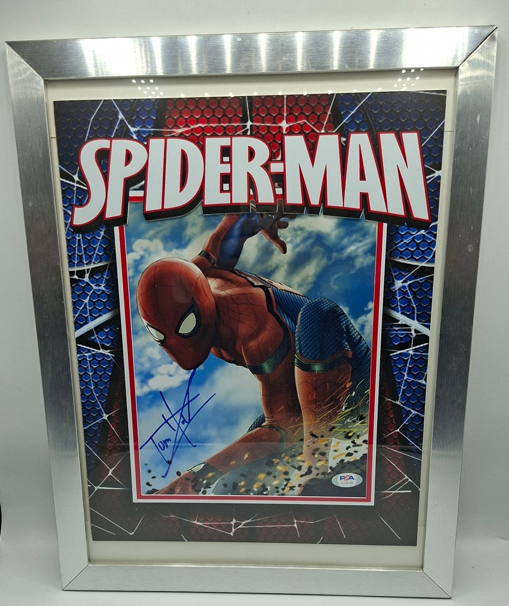 Spiderman photo signée par Tom Holland. Encadré. DC COMICS JSA