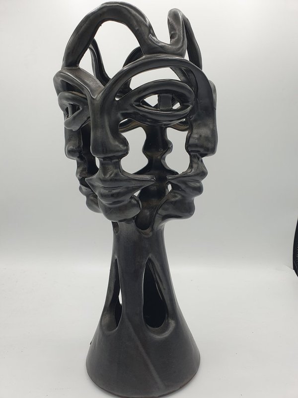 4 faces vase, black, by Jean Marais