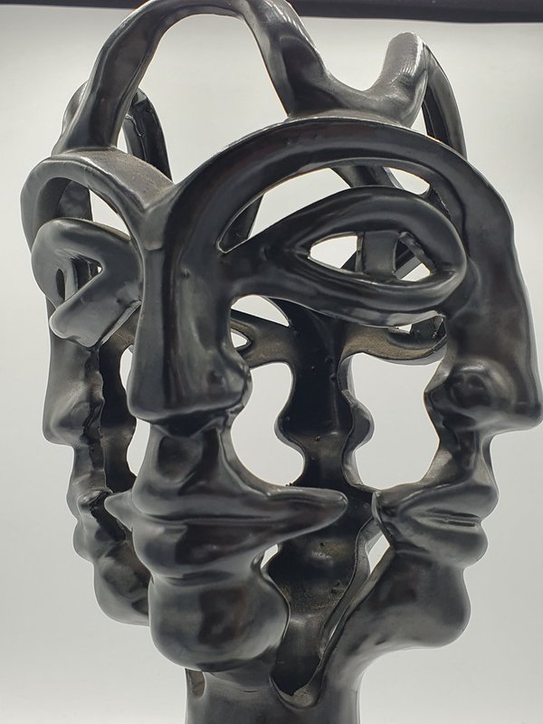 4 faces vase, black, by Jean Marais